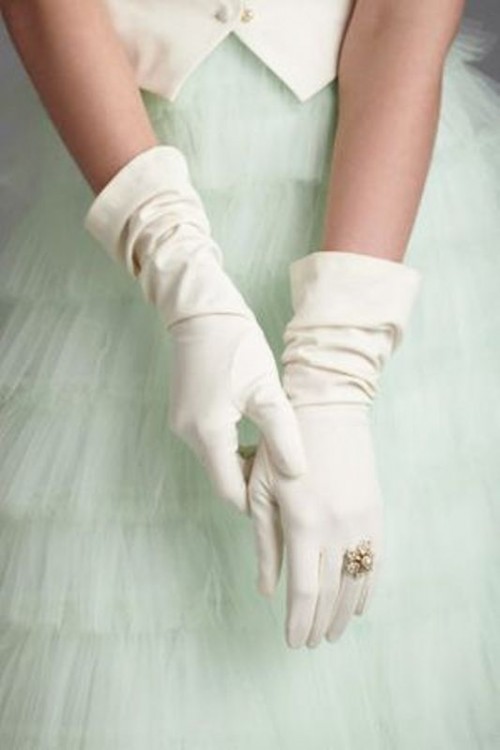 long white plain gloves with a vintage pearl engagement ring right on the glove look wow