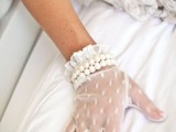 white lace gloves with two rows of pearls look chic and accented and will be a gorgoeus vintage wedding accessory