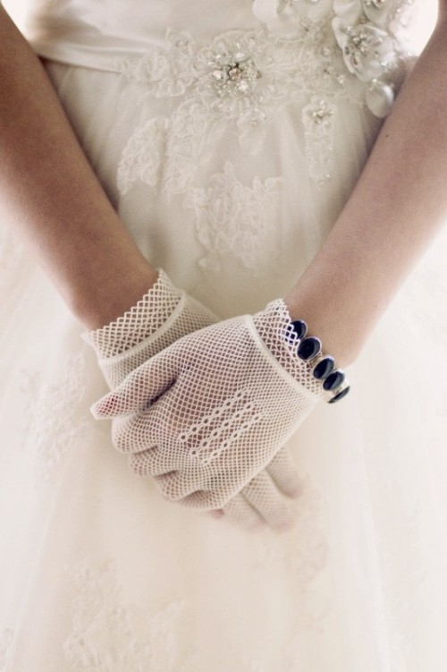 net lace gloves and a purple rhinestone bracelet will accent your vintage outfit adding a bit of color to it