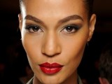 a bold and statement makeup with a red lip and chic smokey eyes that don’t stand out too much