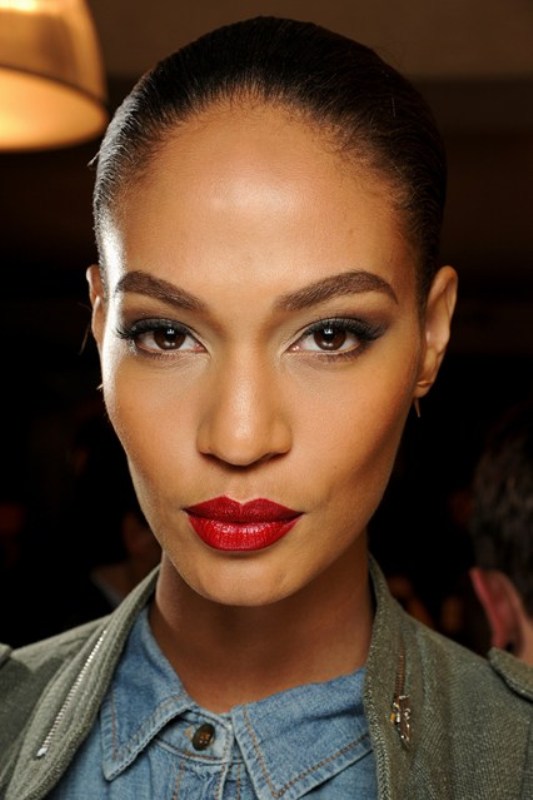 a bold and statement makeup with a red lip and chic smokey eyes that don't stand out too much