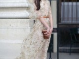 a neutral floral print A-line wedding dress with short sleeves and a plunging neckline is very flowy and airy