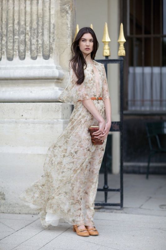 A neutral floral print A line wedding dress with short sleeves and a plunging neckline is very flowy and airy