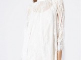 a lace mini dress with a plain underdress, long sleeves and a high illusion neckline for a boho bride