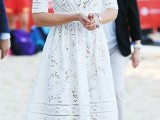a white crochet lace A-line midi wedding dress with a high neckline, short sleeves is a cool boho wedding gown option