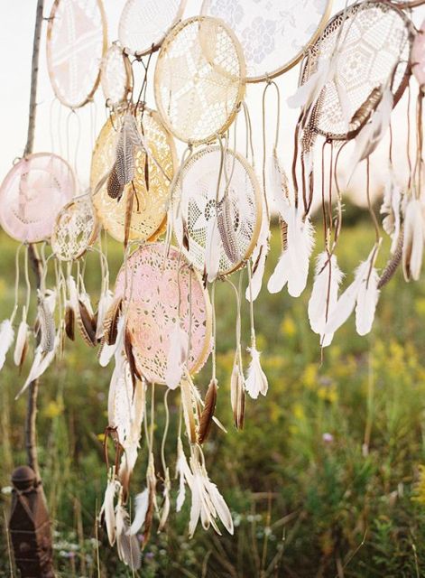Dream catchers with crochet lace and feathers for a wedding backdrop or a beautiful wedding altar