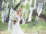 a wedding backdrop of many dreamcatchers with long fringe is a truly boho idea to go for