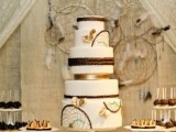 a dream catcher backdrop with feathers and beads is nice for a cake table, a sweetheart table or a wedding ceremony