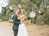 a tree with some dream catchers hanging is a nice idea for wedding decor or even for a wedding altar