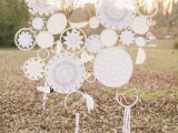 a chic wedding backdrop of multiple crochet dreamcatchers attached to each other for a chic and bold look