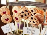 a wooden crate with moss and pie popsicles plus tags is a lovely idea for any rustic wedding or a fairy-tale one