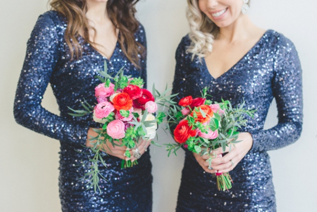 Navy sequin bridesmaid dresses with V necklines and long sleeves are a stylish and bright option for a fall or winter wedding
