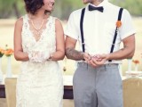 a vintage groom’s look with a white short-sleeved shirt, black suspenders and grey pants, a black bow tie is a lovely way to show off his arm tattoos