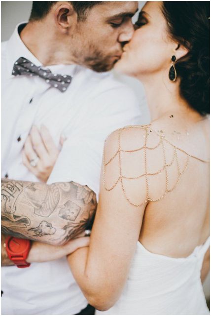 a short sleeved shirt shows off the groom's arm tattoos at their best, you may also cuff the sleeves if you want