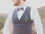 a vintage-inspired look with black pants, a grey waistcoat, a white shirt, a grey bow tie and a grey cap