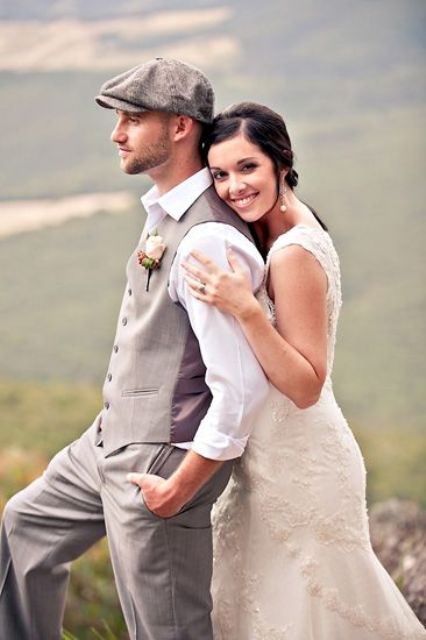 a vintage-inspired groom's look with grey pants and a waistcoat, a cap, a tie and a white shirt