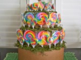 a stand with super colorful lollipops is a lovely and fun idea for a wedding with much color