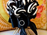 a catchy and bold wedding bouquet of black and white lollipops, with a large black bow is a lovely idea for Halloween