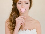 a pink heart-shaped lollipop is a lovely wedding favor or a dessert for your wedding dessert table