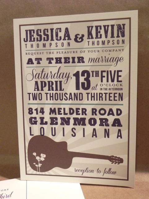 a wedding sign with printing and a guitar is a lovely and cool idea to rock, it will show what you like