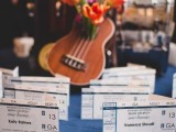a guitar filled with bright blooms is a very cool and fun decoration to rock at a wedding