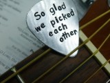 a flat pick with an engraving is a cool wedding favor idea that won’t cost too much