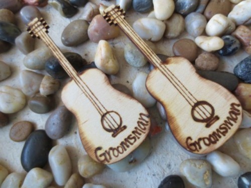 mini wood burnt guitar boutonnieres like these ones will make your groomsmen looks bolder and quirkier