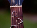 show off your wedding rings on a guitar to feature your interests