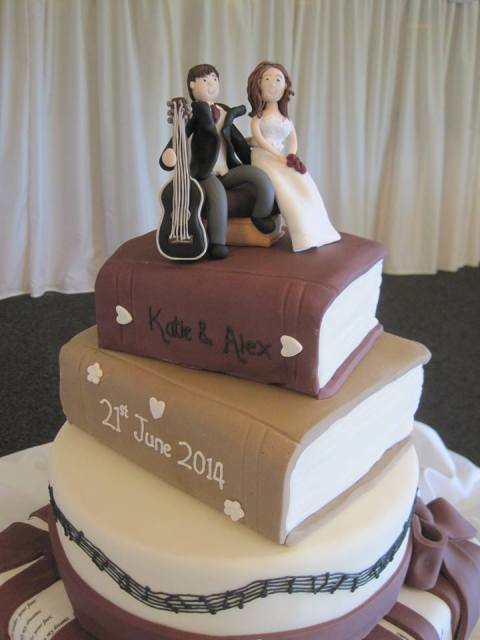 a cool books and guitar wedding cake