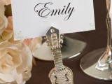 an embellished guitar card stand is a lovely and chic idea for a wedding tablescape