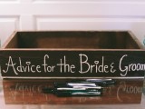 a stained wooden crate with chalking is a stylish idea for a rustic wedding, you can easily DIY it
