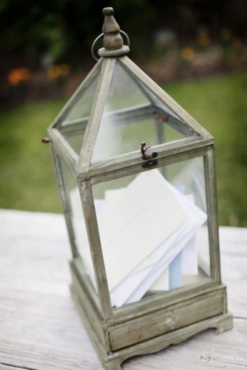 a simple brushed vintage lantern is a creative alternative to a usual card box at your wedding