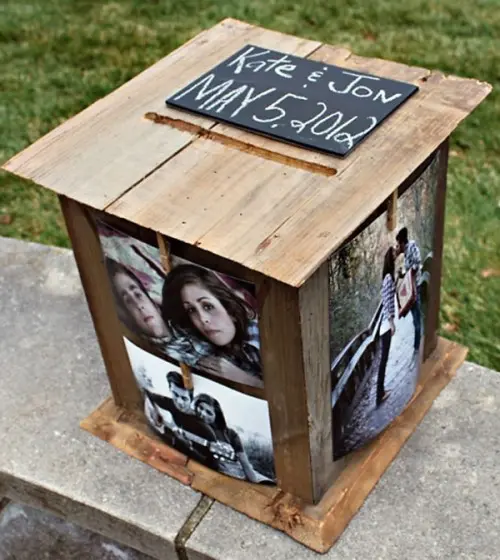 a creative rustic wooden card box with the couple's photos and a chalkboard tag on top is a cool idea for a simple laid-back wedding