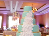 a tiffany blue wedding cake decorated with ropes and white orchids is a great option for a beach wedding