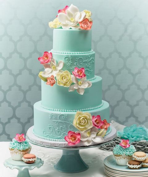 a tiffany blue wedding cake with coral and neutral sugar blooms is a bright idea for spring or summer