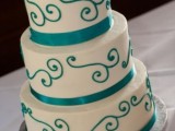 a white and tiffany blue wedding cake with pretty ribbons and patterns is a creative and chic idea that always works