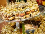 a whole stand with very mini burgers of various delicious stuff is a cool idea for a modern wedding
