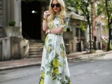 a green and yellow floral print maxi dress with short sleeves, statement accessories for a spring wedding