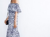 an off the shoulder black and white polka dot maxi dress, a black bag is classic monochrome for a modern spring wedding