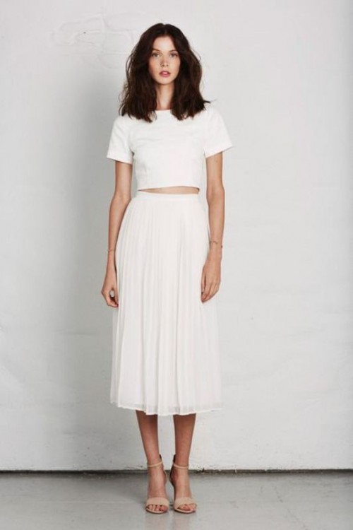 a casual white separate of a crop top with short sleeves and a midi skirt plus nude shoes for spring