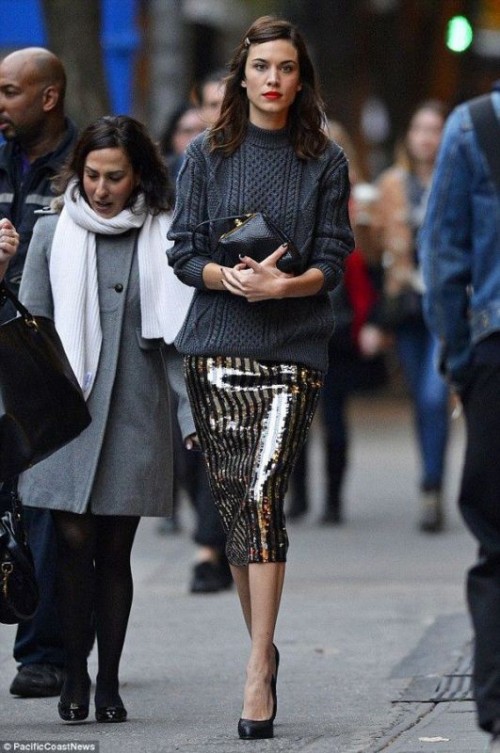 a graphite grey patterned sweater, black and gold sequin midi pencil skirt, a mini bag and black shoes