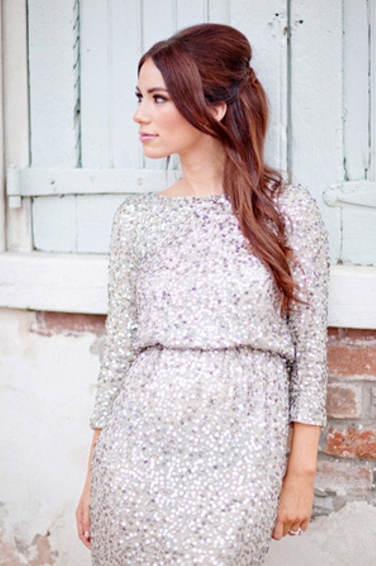 A silver sequin dress with a high neckline and long sleeves is a chic and beautiful option for any winter wedding