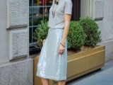 a cool winter wedding guest look with a grey tee, a grey sequin pencil skirt, layered necklaces and black heels