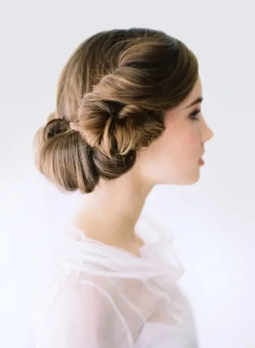 a twisted low updo inspired by Princess Lea's hairstyles is a lovely and cool idea to rock