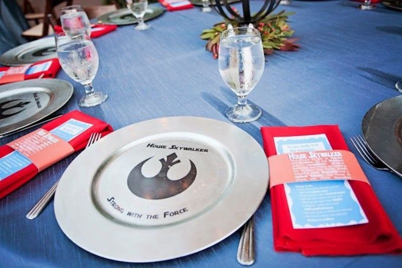 A silver charger with a Star Wars print is a lovely and cool idea for a modern star Wars themed wedding