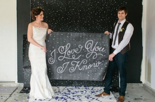a chalkboard sign with a quote from Star Wars is a very cool and cute idea for a Star Wars wedding