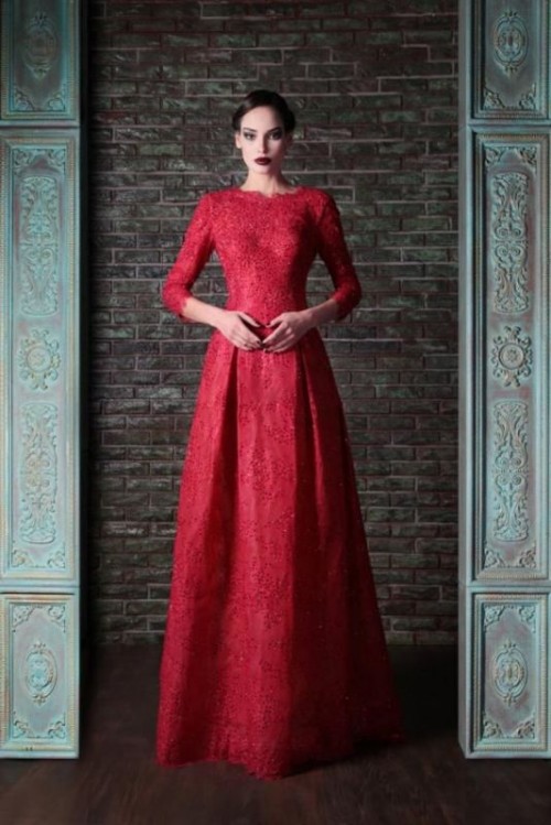 a red lace A-line wedding dress with a high neckline, long sleeves and a pleated skirt for a Gothic bride