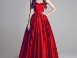 a deep red strapless wedding ballgown with a sleek bodice and a pleated full skirt for a bold statement with color