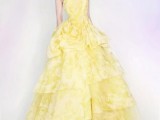 a yellow and white strapless wedding ballgown with a ruffled skirt is a bold statement you may make with both color and design