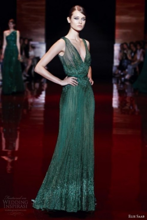 a green fully embellished wedding dress with a plunging neckline and thick straps is a bold and gorgeous statement you can make at a fall wedding
